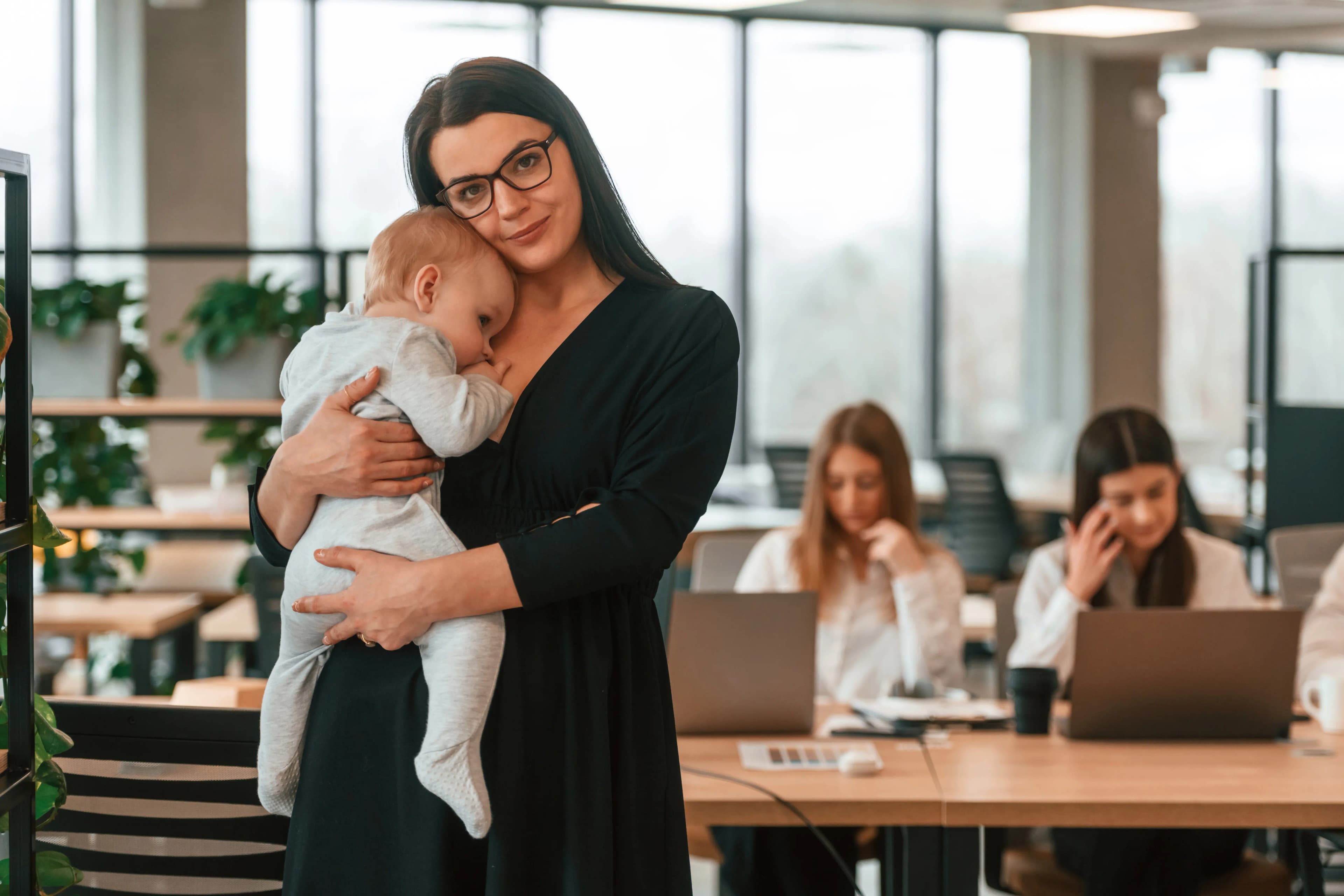 Baby in an office where adults are working